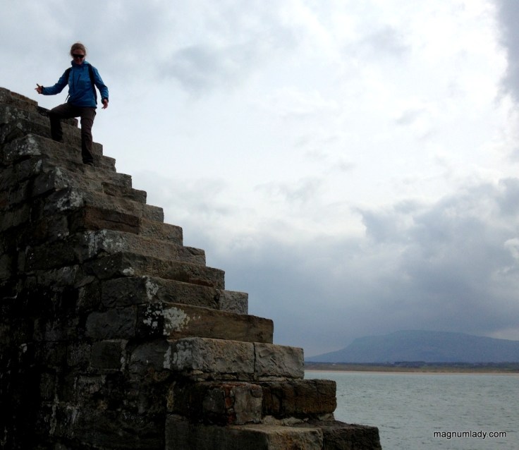Auriel climbing the cliff wall