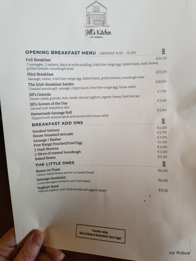 A breakfast menu from Jill's Kitchen featuring a variety of dishes including Full Breakfast, Mini Breakfast, and add-ons like smoked salmon and avocado.